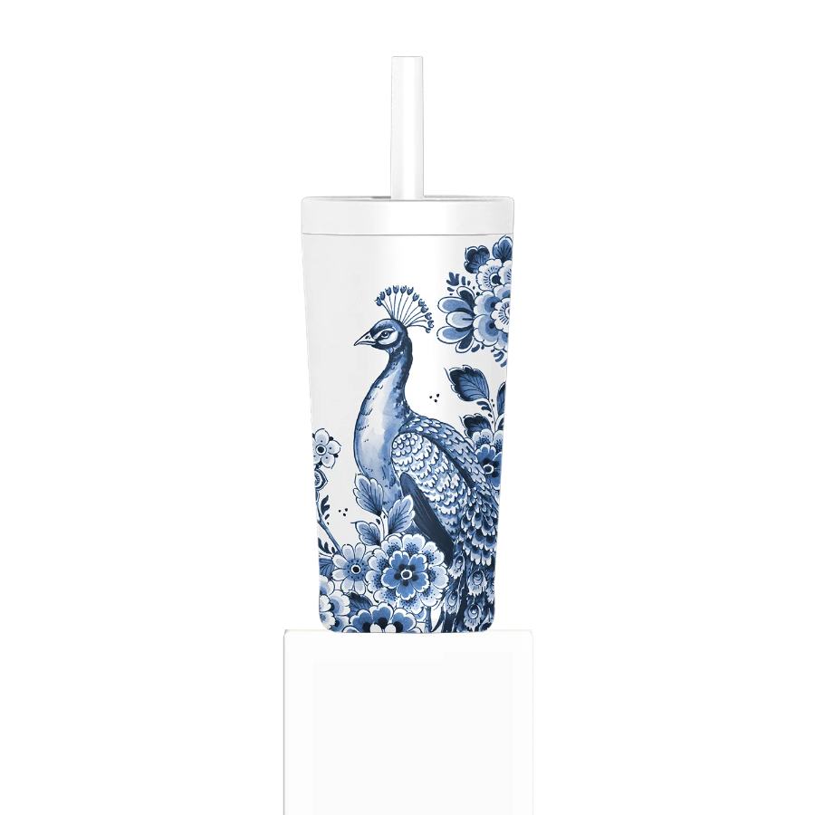 Tumbler with blue peacock and floral design on a white background
