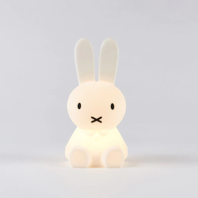 White rabbit-shaped night light on a light gray background