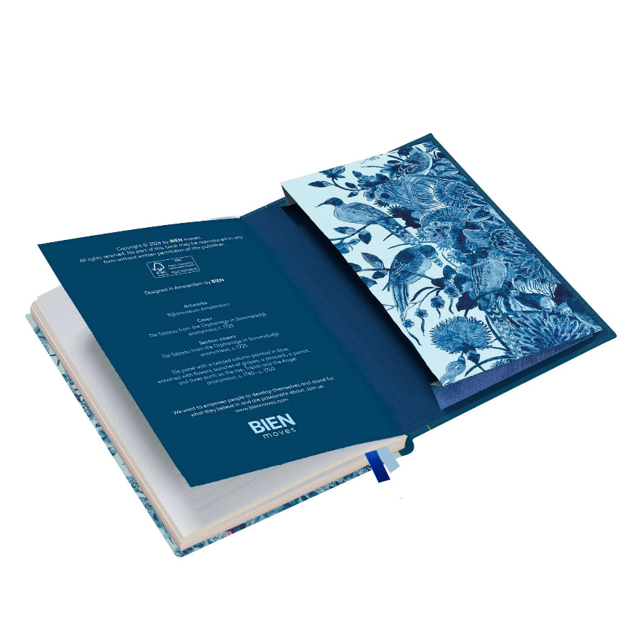 Open book with floral design on the cover on a white background
