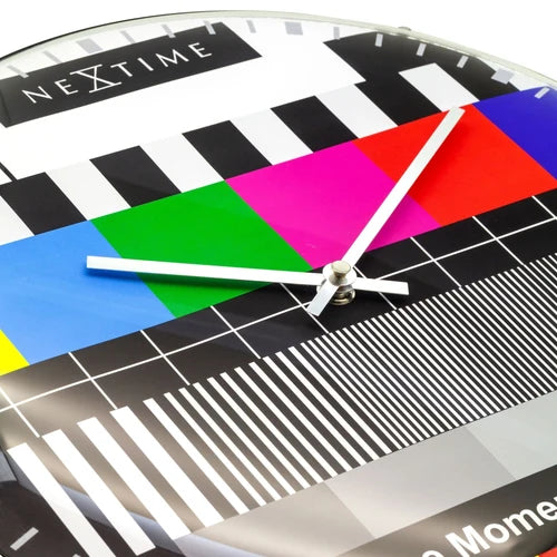 Colorful clock with geometric patterns and 'NeXtime' branding