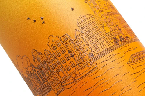 Orange cylindrical object with black line art of a cityscape and boats on a white background