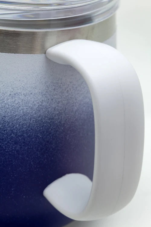 Close-up of a blue insulated mug with a white handle on a white background