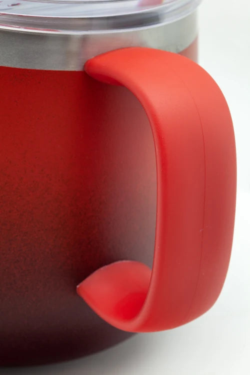 Close-up of a red insulated tumbler with a large curved handle and a clear lid, shown on a white background.