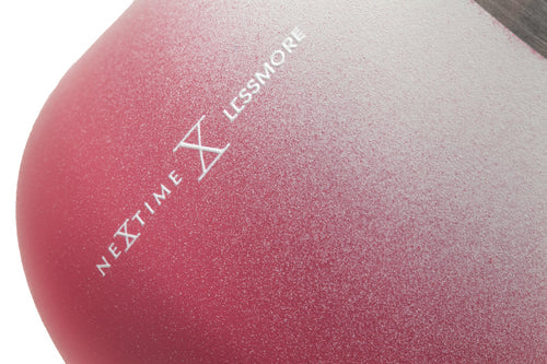 Close-up of a pink ball with 'Nextime Lessmore' branding on a white background