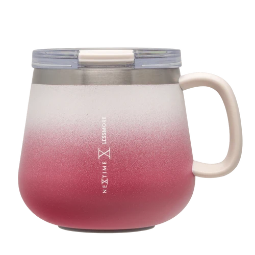 A Next Time Lossmore insulated travel mug with a frosted ombre design transitioning from white at the top to a dusty rose pink at the bottom. It features a cream-colored handle, a stainless steel rim, and a clear plastic lid with a cream straw insert.