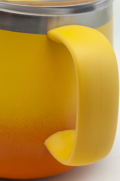 Close-up of a yellow insulated mug with a large integrated handle and a stainless steel rim at the top.