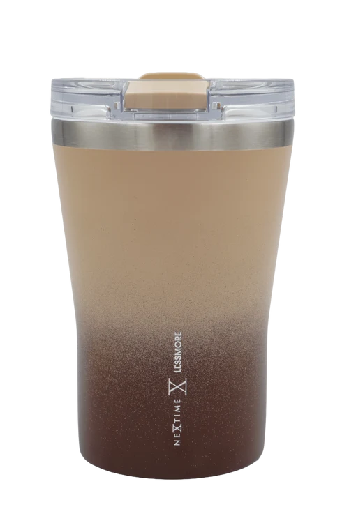 A stainless steel travel tumbler with a clear lid and a beige-to-brown ombre gradient body, featuring the 'NEXT TIME LESS TIME' logo printed vertically near the bottom.