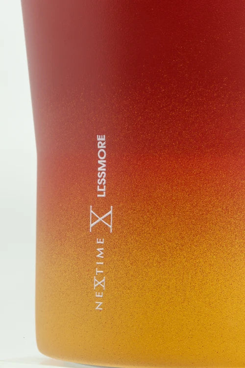 Gradient bottle with 'Nextime' and 'Lessmore' branding on a white background