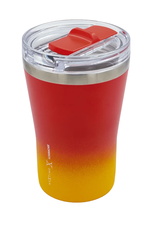 A stainless steel travel tumbler with a red and yellow gradient finish, featuring a clear lid with a red flip-top straw cover, shown on a white background.