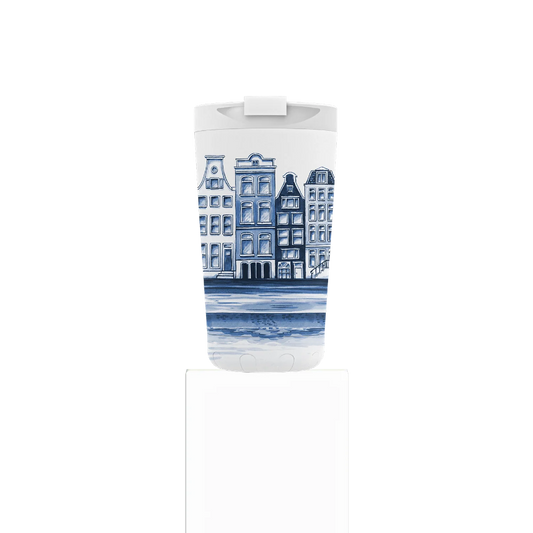 Tumbler with blue and white architectural design on a white background