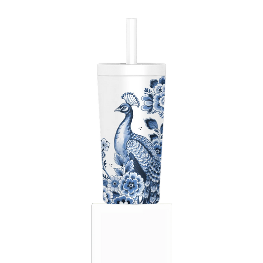 Tumbler with blue peacock and floral design on a white background