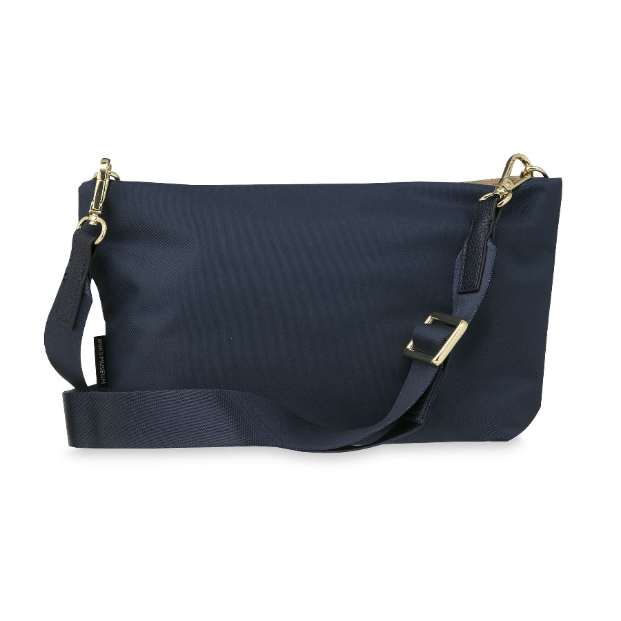A navy blue nylon shoulder bag with a wide adjustable strap and gold-tone hardware, shown against a plain white background.