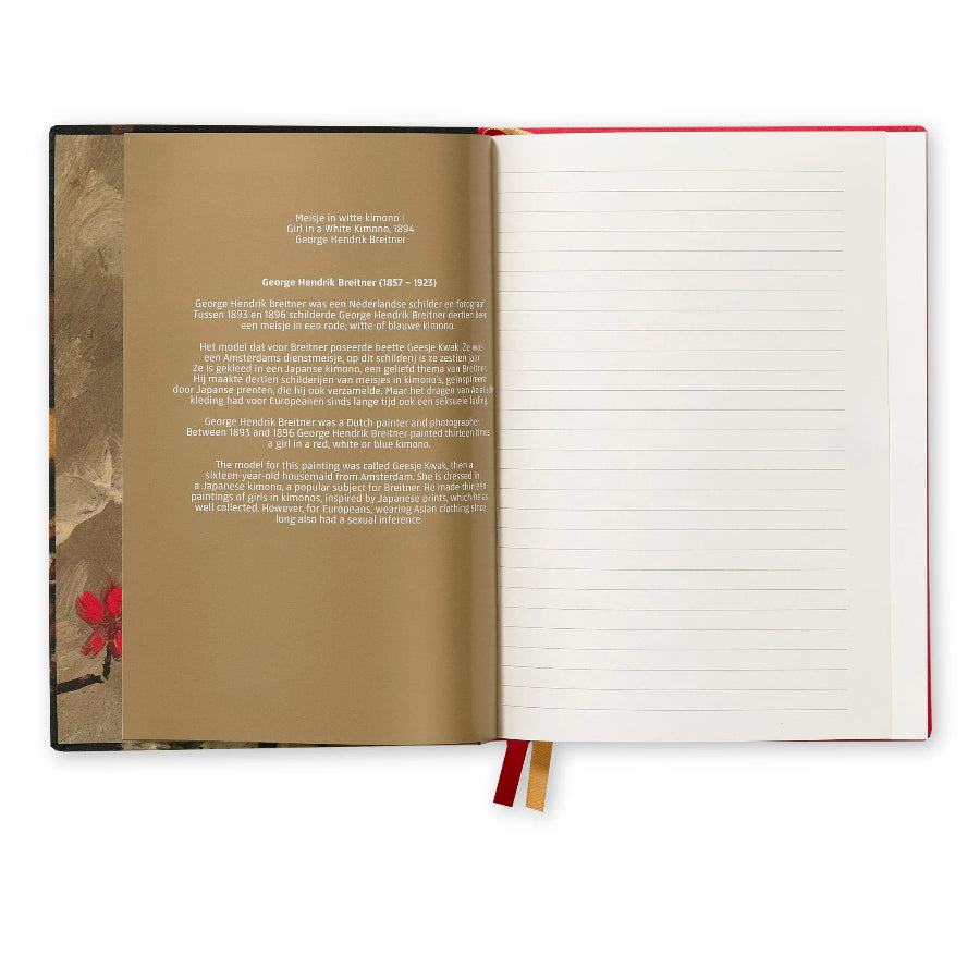An open hardcover journal or notebook on a white background, showing the back of the left page with printed text and a textured border, and the right page with horizontal lines. The cover is a warm tan/brown color with a small red floral detail, and the pages are white with red and gold ribbon bookmarks.
