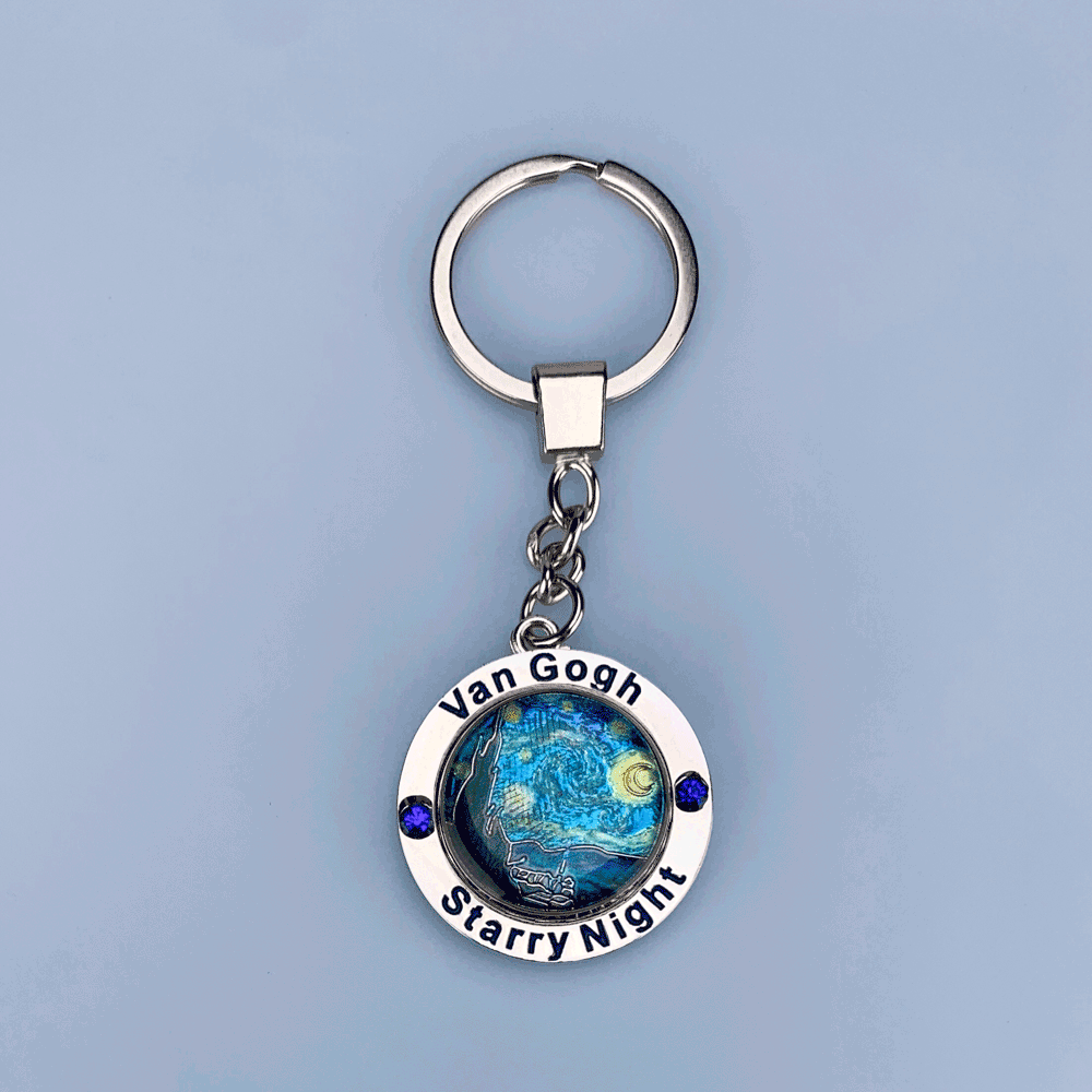 Metal spinner keychain featuring The Starry Night by Vincent van Gogh rotating design