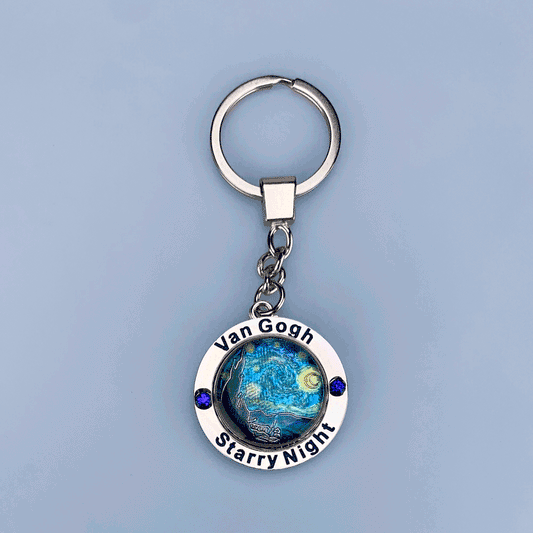 Metal spinner keychain featuring The Starry Night by Vincent van Gogh rotating design