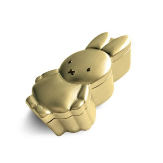 Gold bunny-shaped container on a white background