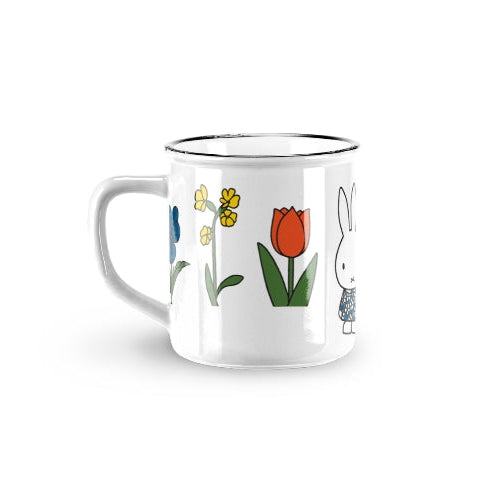 Mug with colorful illustrations of flowers and a character on a white background
