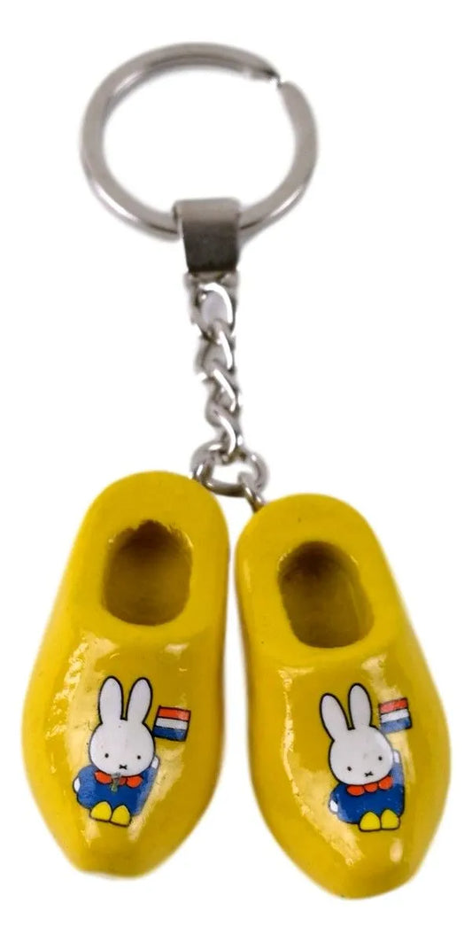 Double Miffy keychain featuring a traditional blue Dutch costume, Dutch flag, and miniature wooden clogs. A charming accessory and collector's item.