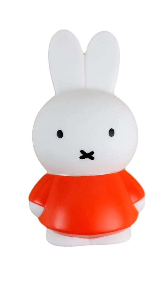 White rabbit figure with a red shirt on a white background