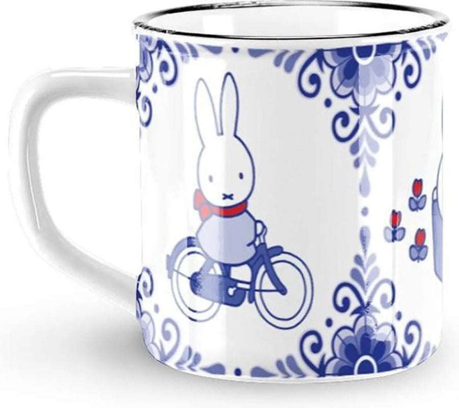Mug with a rabbit character on a bicycle design, featuring blue floral patterns on a white background.