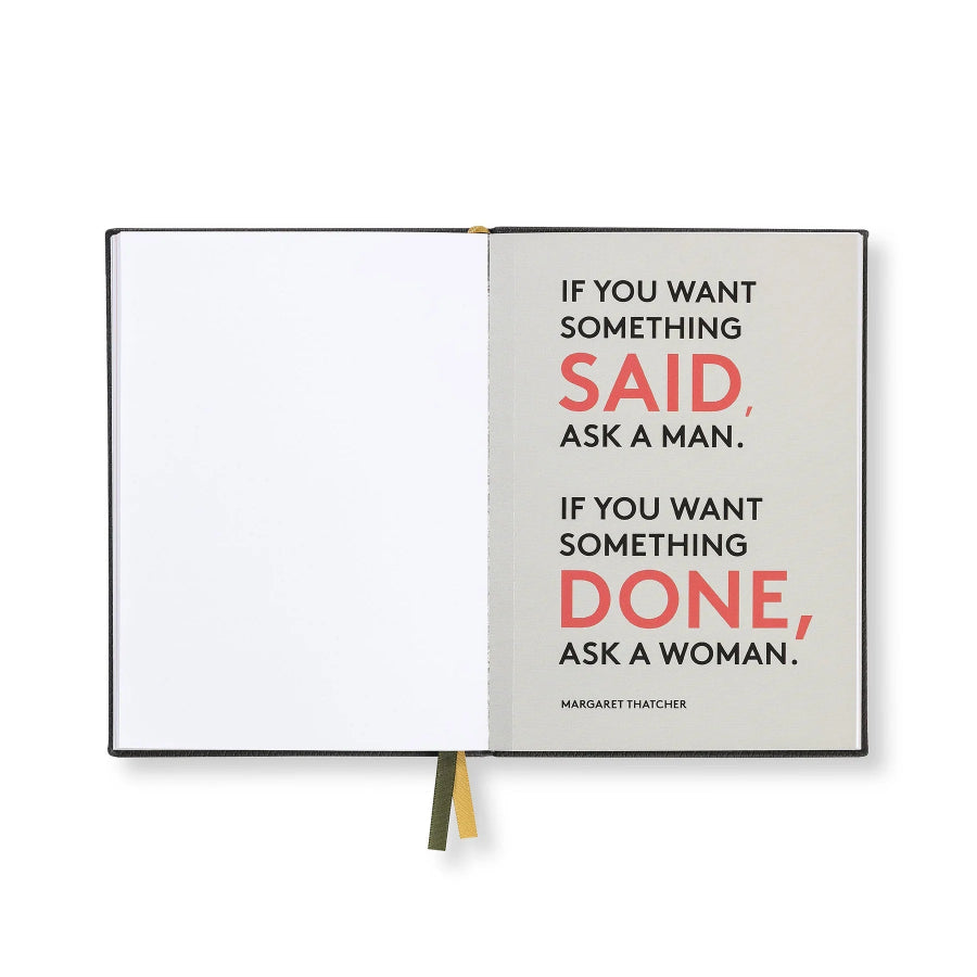 An open hardcover notebook or journal on a white background, showing a quote printed on the right page: 'IF YOU WANT SOMETHING SAID, ASK A MAN. IF YOU WANT SOMETHING DONE, ASK A WOMAN.