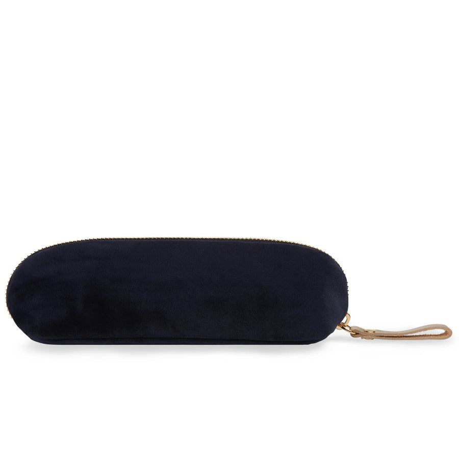 A dark navy blue velvet zippered pouch with a gold zipper and a tan leather wristlet strap, shown on a plain white background.