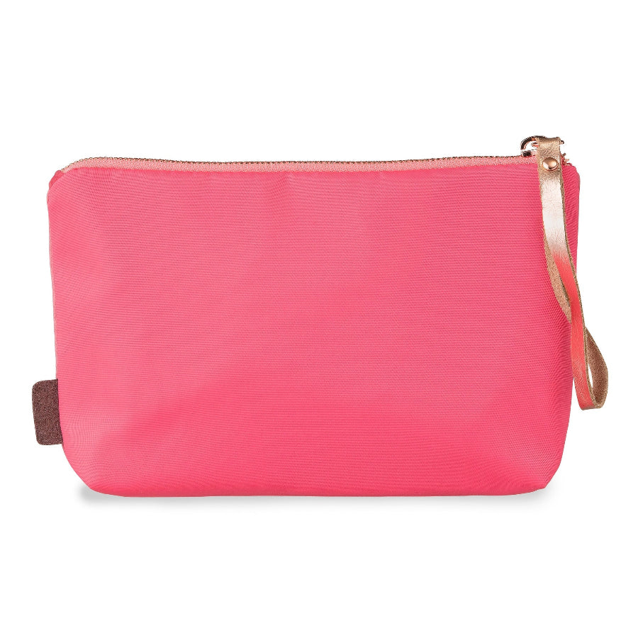 A bright pink nylon pouch with a top zipper, a matching pink wristlet strap, and a small brown leather brand tab on the left side, shown against a plain white background.