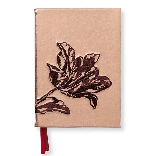 A hardcover notebook with a textured rose gold cover featuring an embossed dark brown tulip design, complete with a red ribbon bookmark, shown on a plain white background.