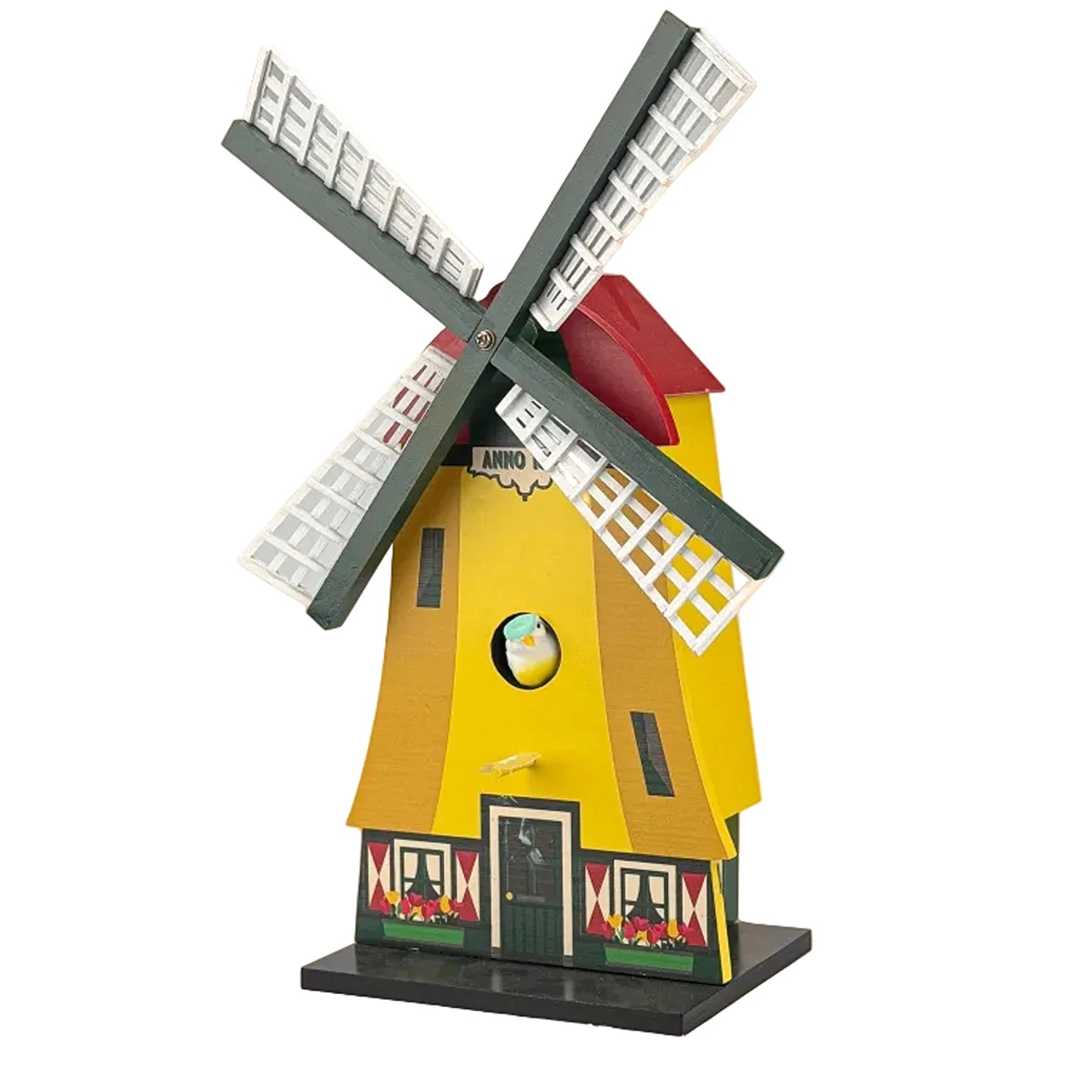 Yellow wooden birdhouse shaped like a Dutch polder windmill garden decoration