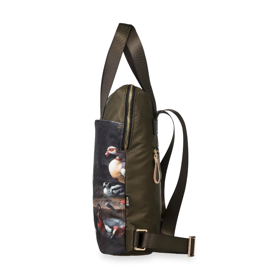 An olive green sling bag with a large front pocket featuring a detailed duck and waterfowl print, shown against a plain white background.