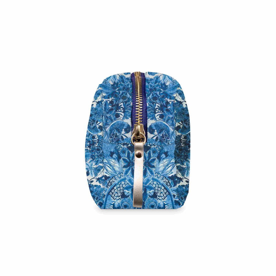 A small zippered pouch with a blue and white floral pattern, featuring a gold-toned metal zipper pull, shown against a plain white background.