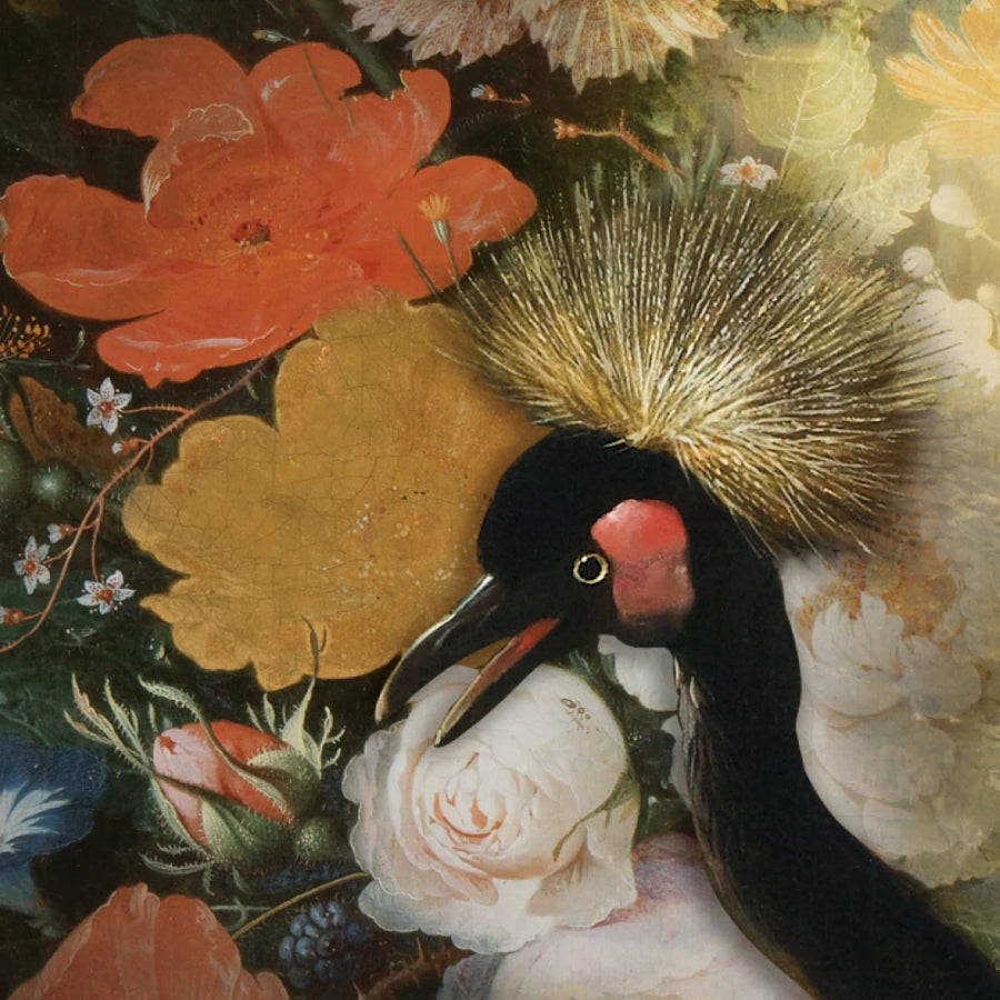 A close-up of a floral and bird artwork featuring a black bird with a bright gold crest and pink facial area, surrounded by large orange, yellow, and white flowers against a dark green background.